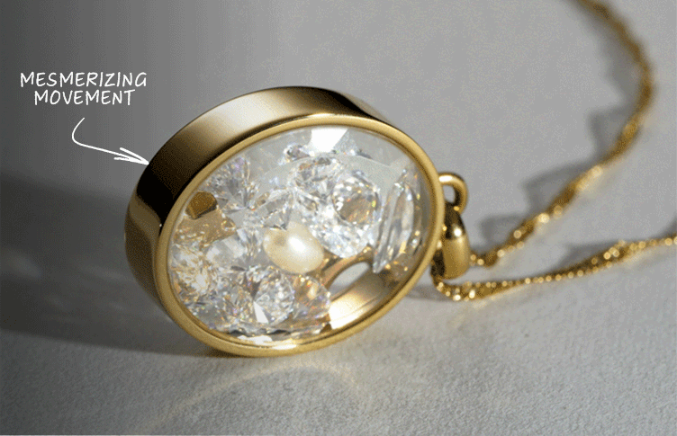 GIF closeup of Fossil’s Shaky Glitz Necklace pendant with fluid, pearls, celestial motifs, and sparkling glitz in motion