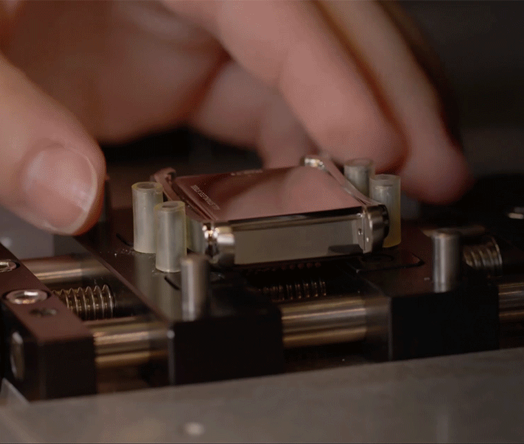 Close-up GIF of engraving machine etching ‘You’re a classic’ on a Fossil watch caseback