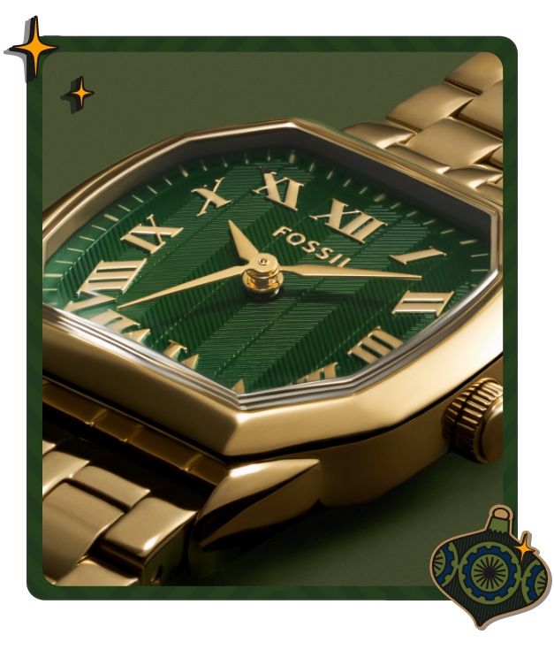 Close-up of Fossil Harlow watch with green dial and gold band, framed by ornament and sparkles with text “Gifts For Her”
