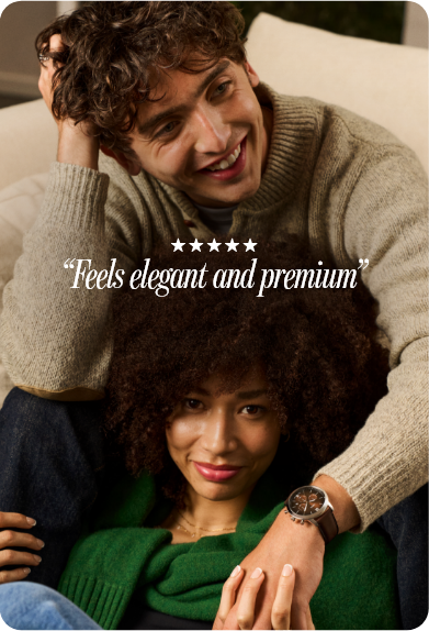 Smiling couple with curly hair cuddling, wearing a Fossil watch; overlaid text reads a quote with five stars.