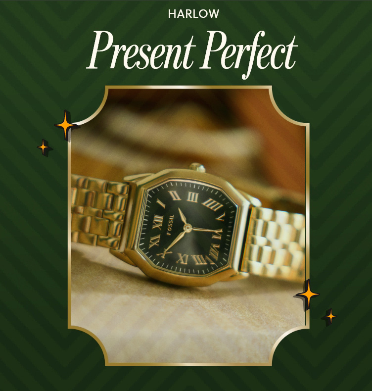 Closeup of Gold-Tone Fossil watch with octagonal case with black dial and roman numerals against a blurry background