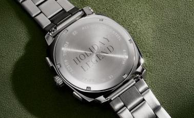 A close-up of back of watch with an engraving Nice-ish List