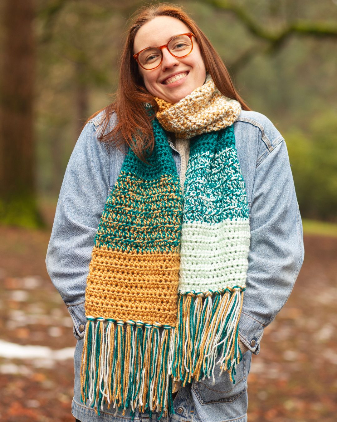 A woman wearing a striped marled scarf