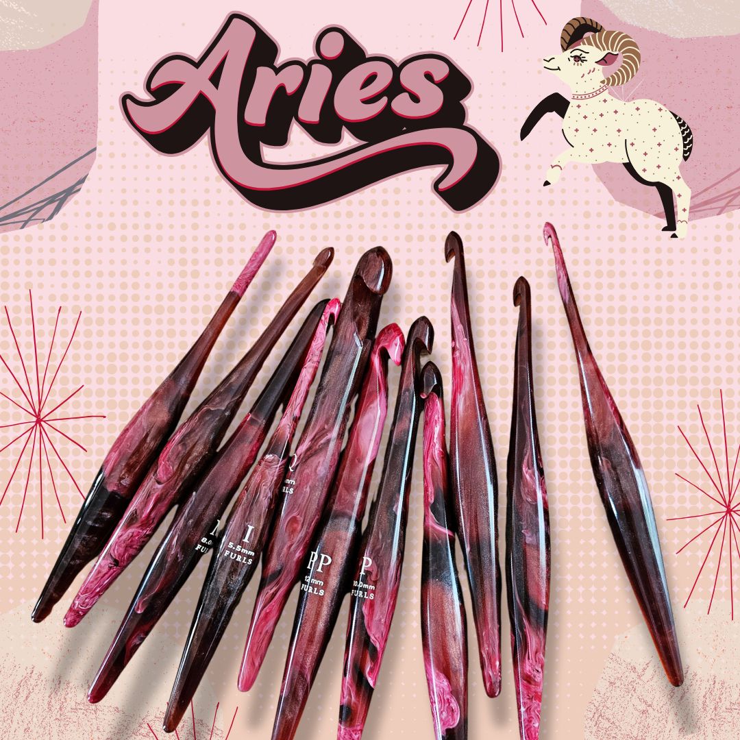 aRIES crochet hooks - red/pink/black hooks on a pink background with text "aries" and an Aries ram graphic