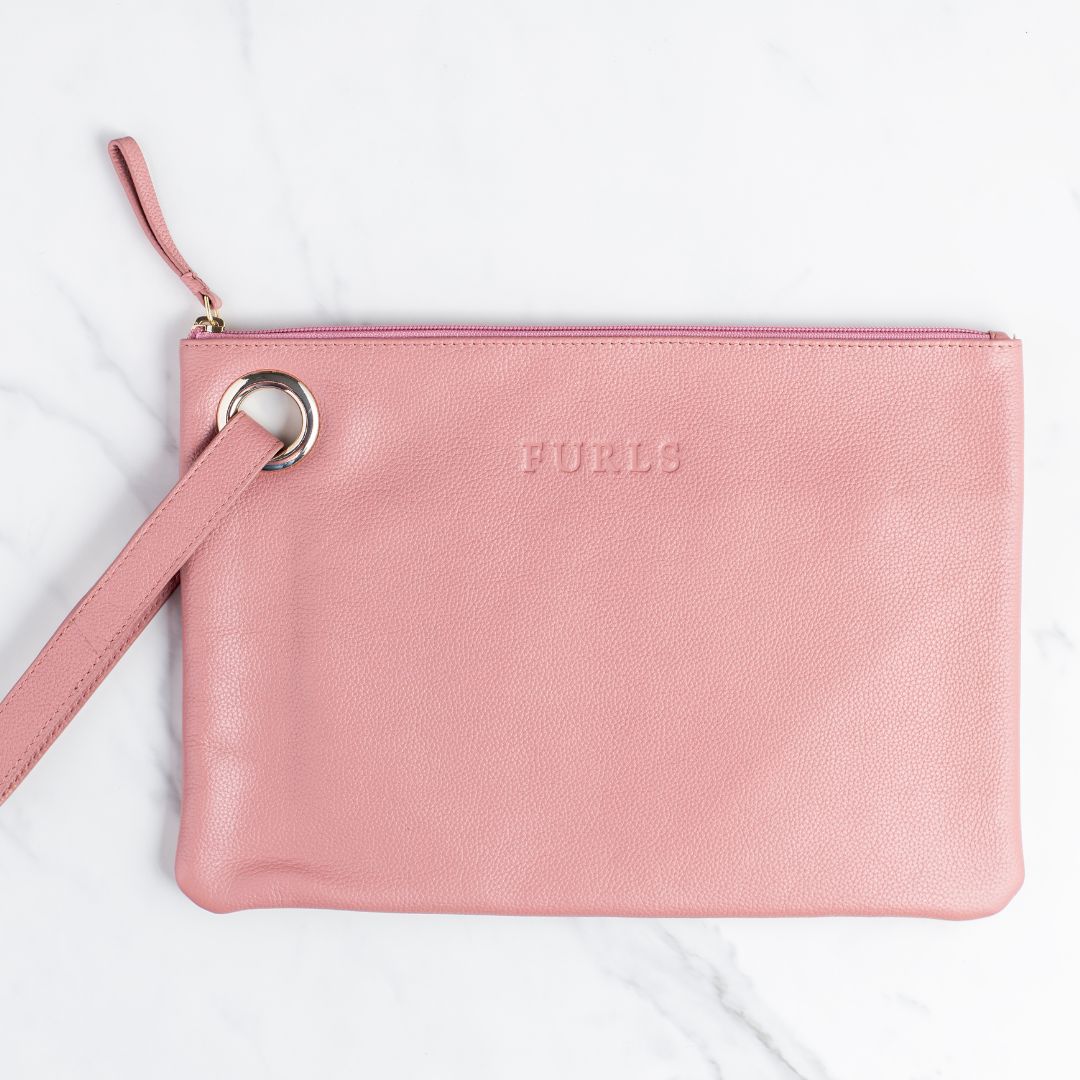 Person holding a Saddle Tan Blair Clutch