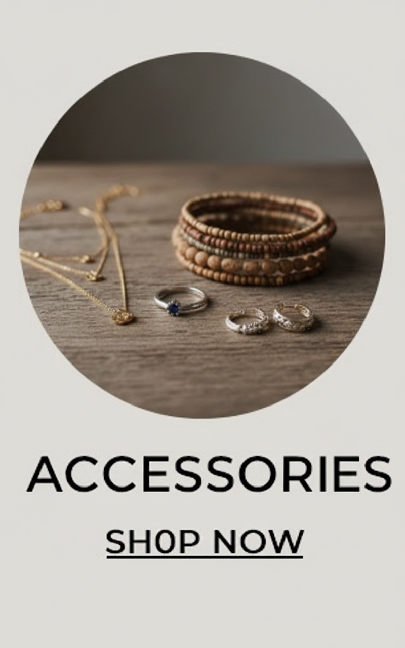 Stack of bracelets, necklaces, and rings on a wooden surface.