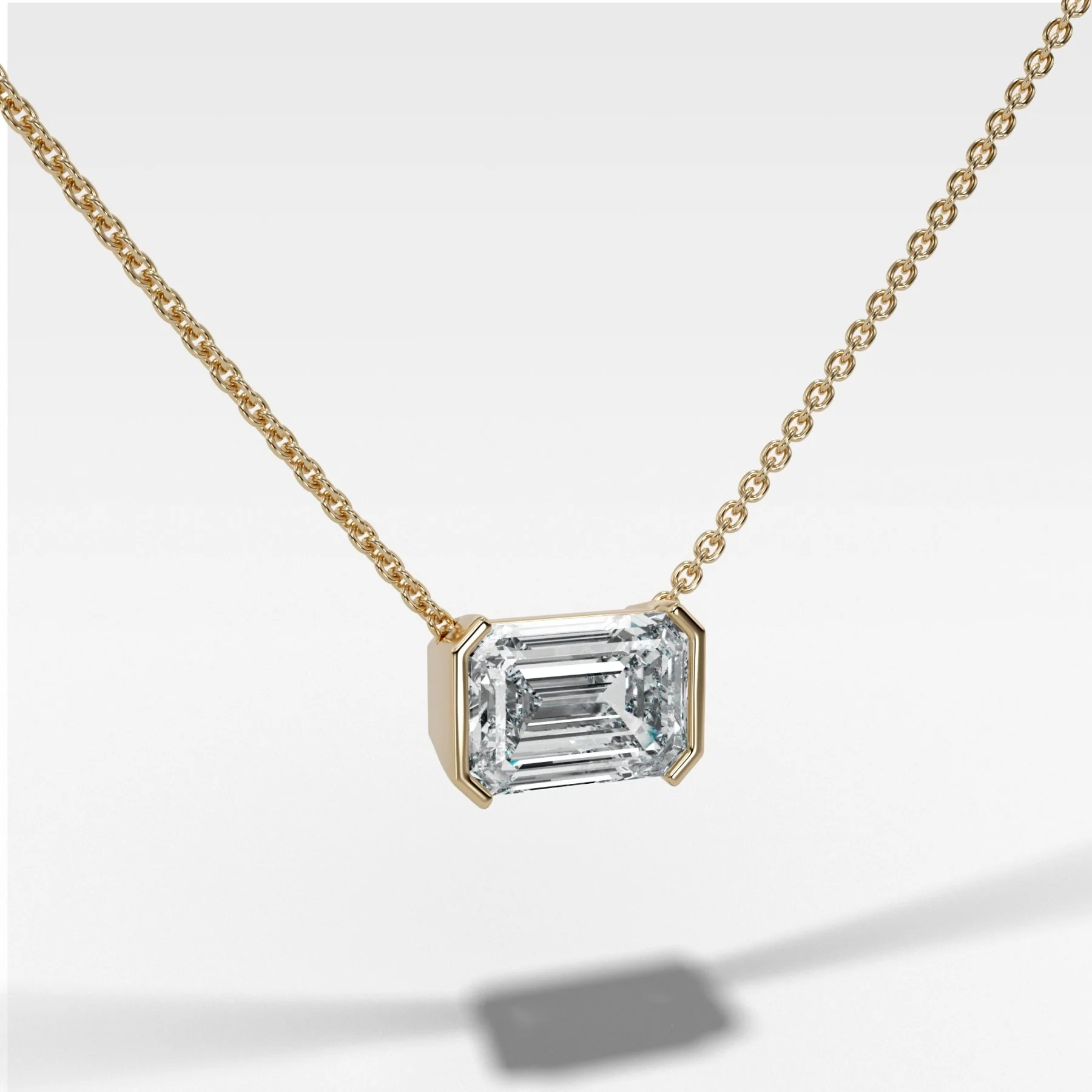Image of East West Half Bezel Pendant Necklace with Emerald Cut Diamond