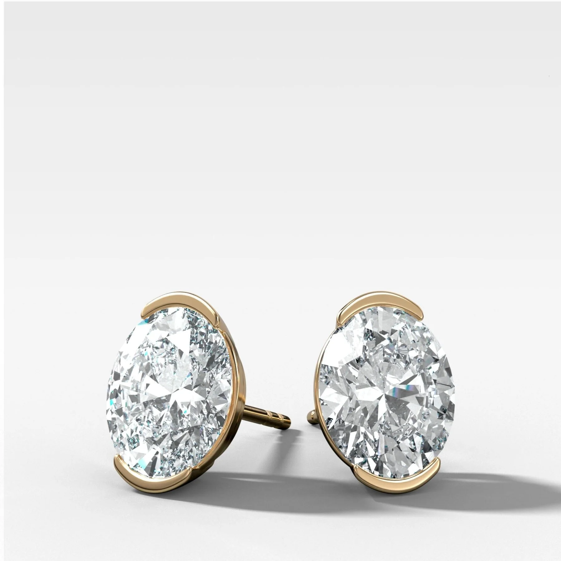 Image of Oval Cut Half Bezel Diamond Studs