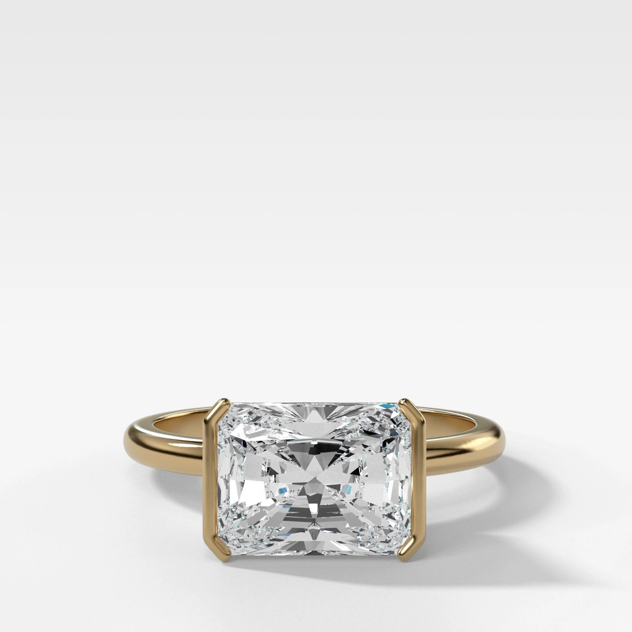 Image of East West Half Bezel Solitaire Engagement Ring With Elongated Radiant Cut Diamond