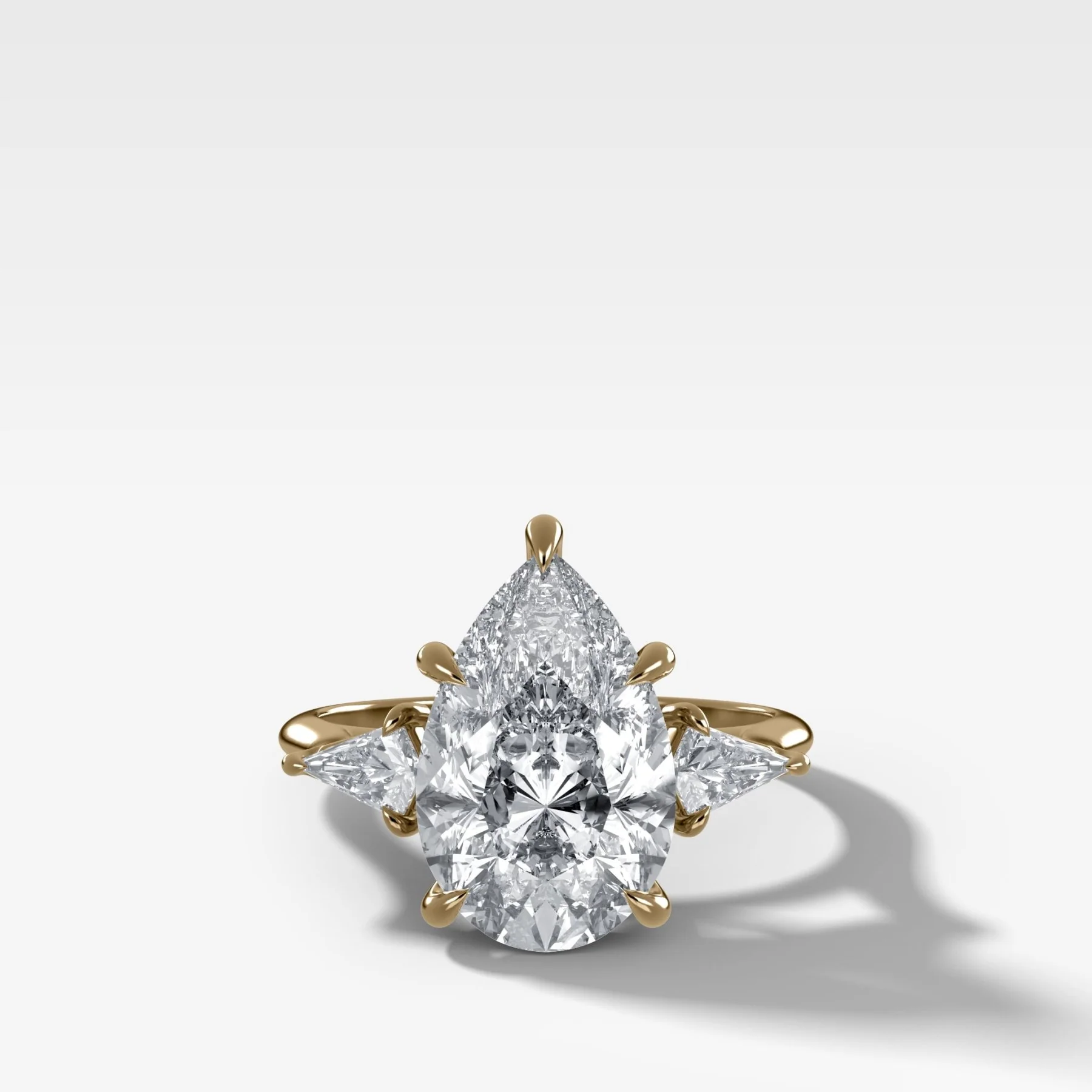 Image of Three Stone Engagement Ring With Kite Side Stones and Pear Cut Diamond
