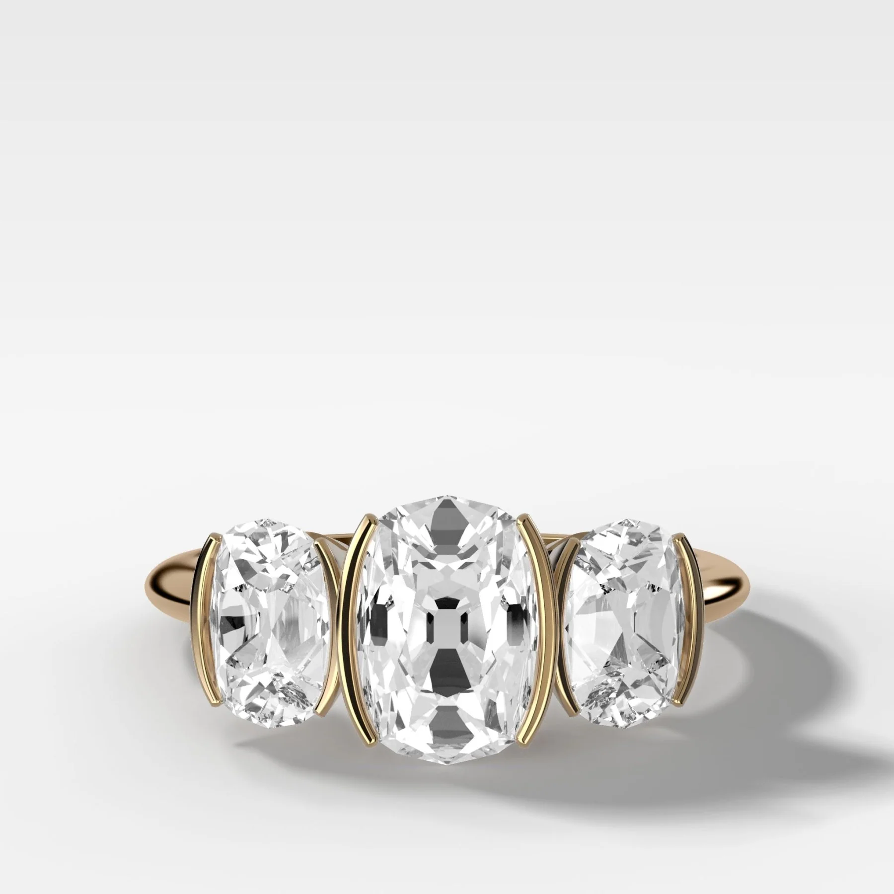 Image of Half Bezel Triad Engagement Ring With Elongated Old Mine Cut Diamonds