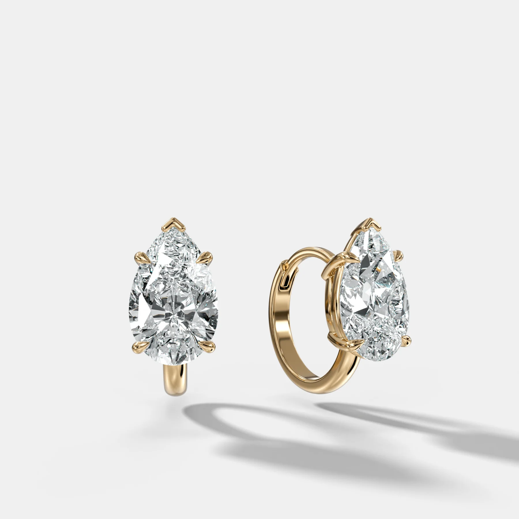 Image of Floating Huggie with Pear Cut Diamonds