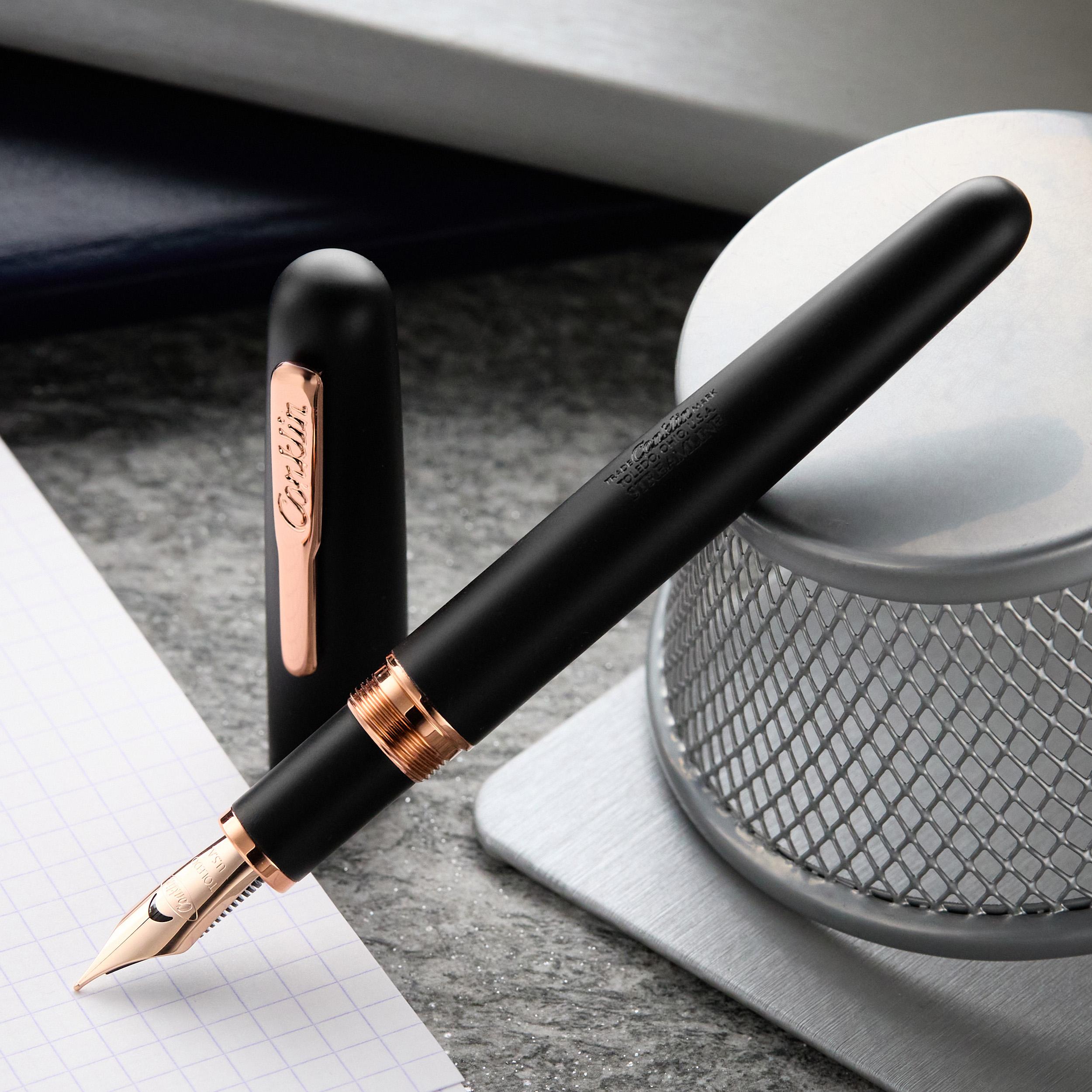 an image of a pen and a cup on a desk