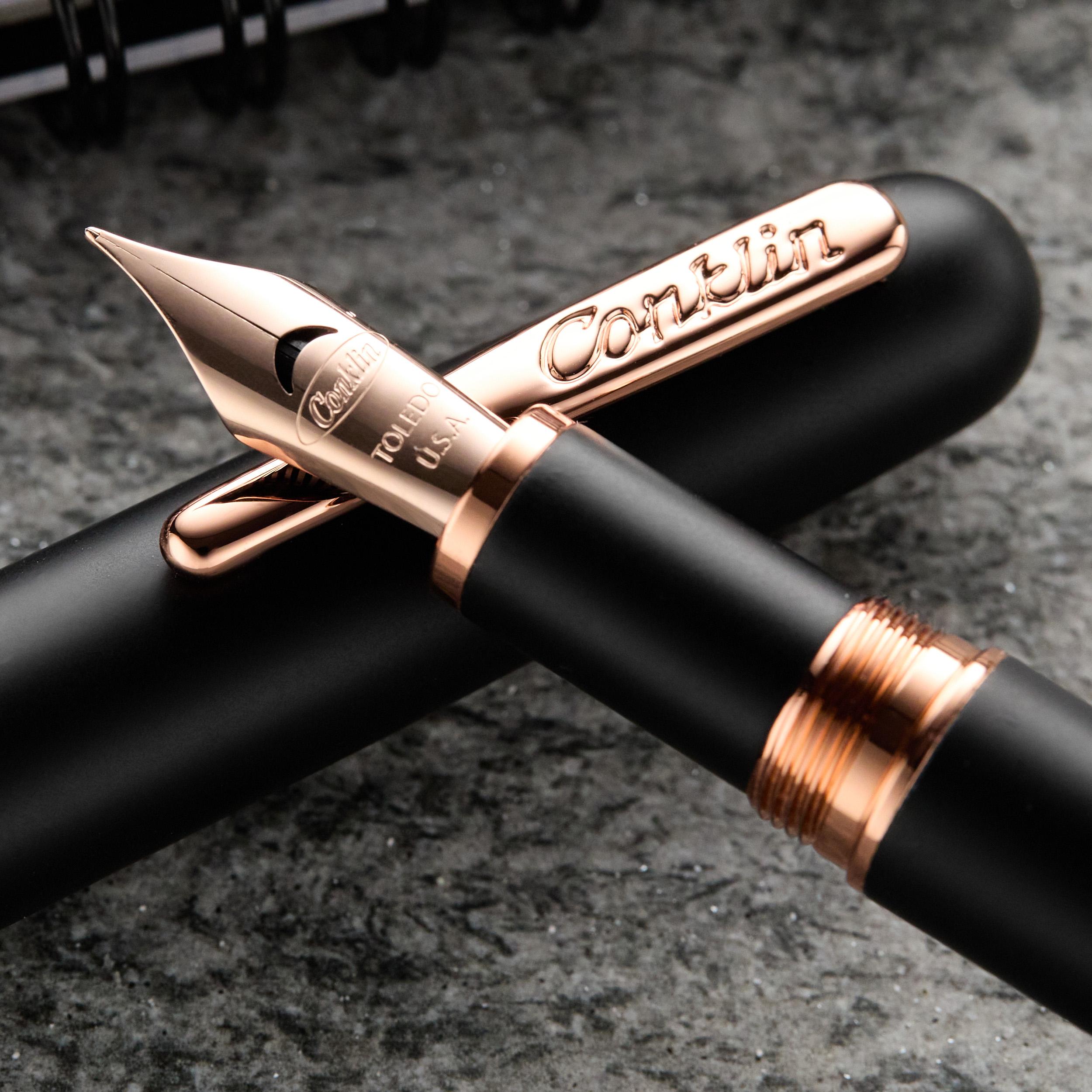 an image of a fountain pen and a pen cap on a table
