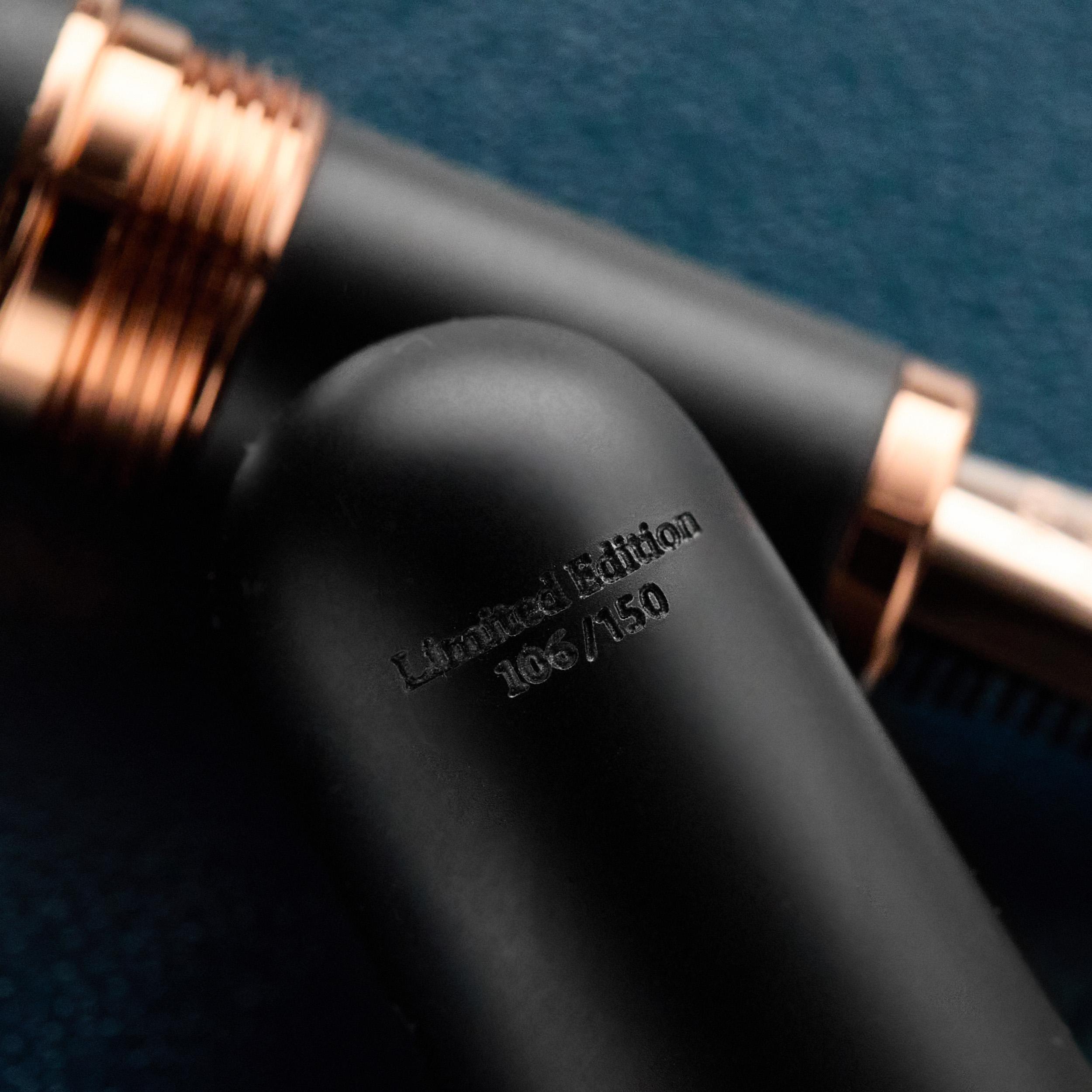 an image of a fountain pen with a black nib and a gold nib