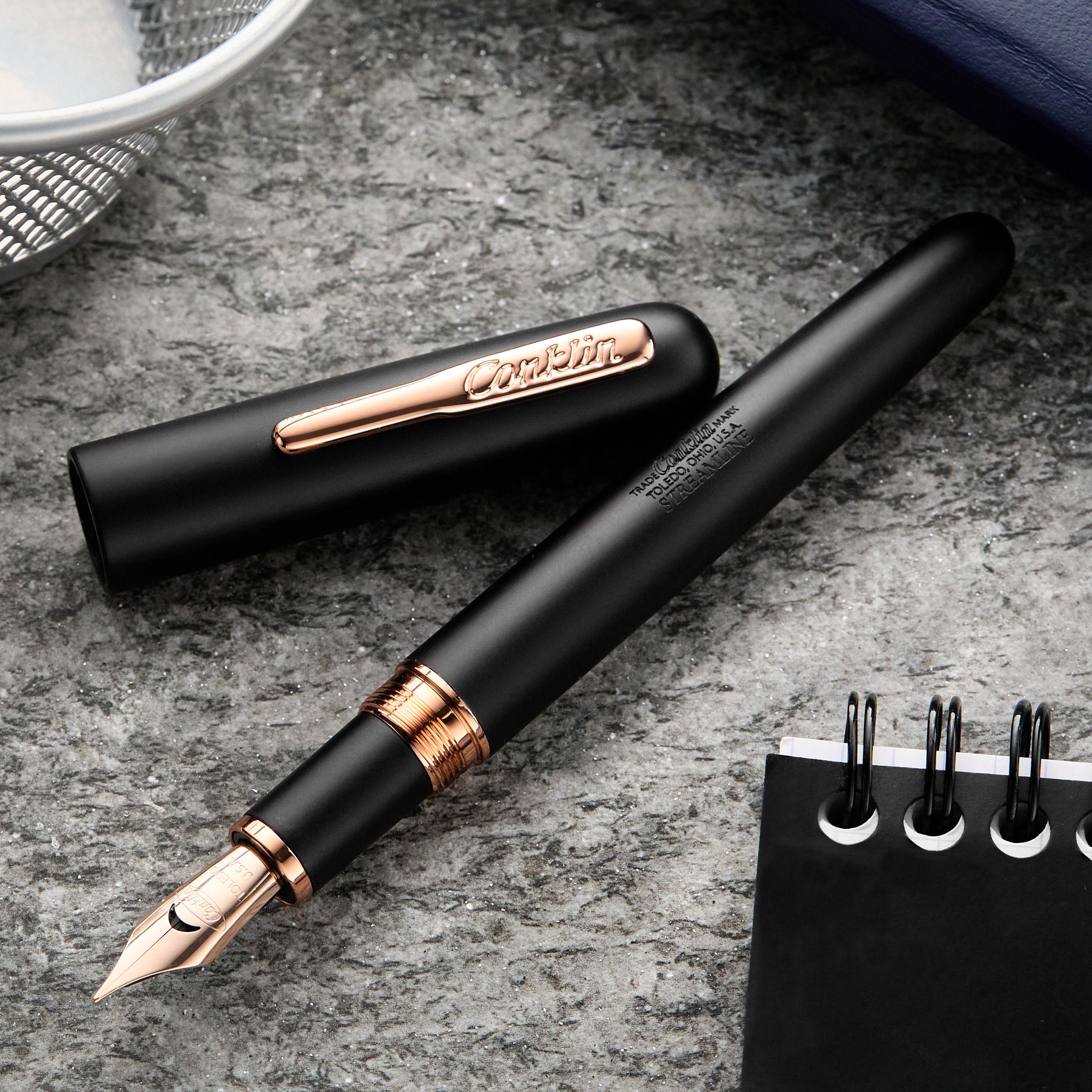 an image of a pen and a notebook on a table