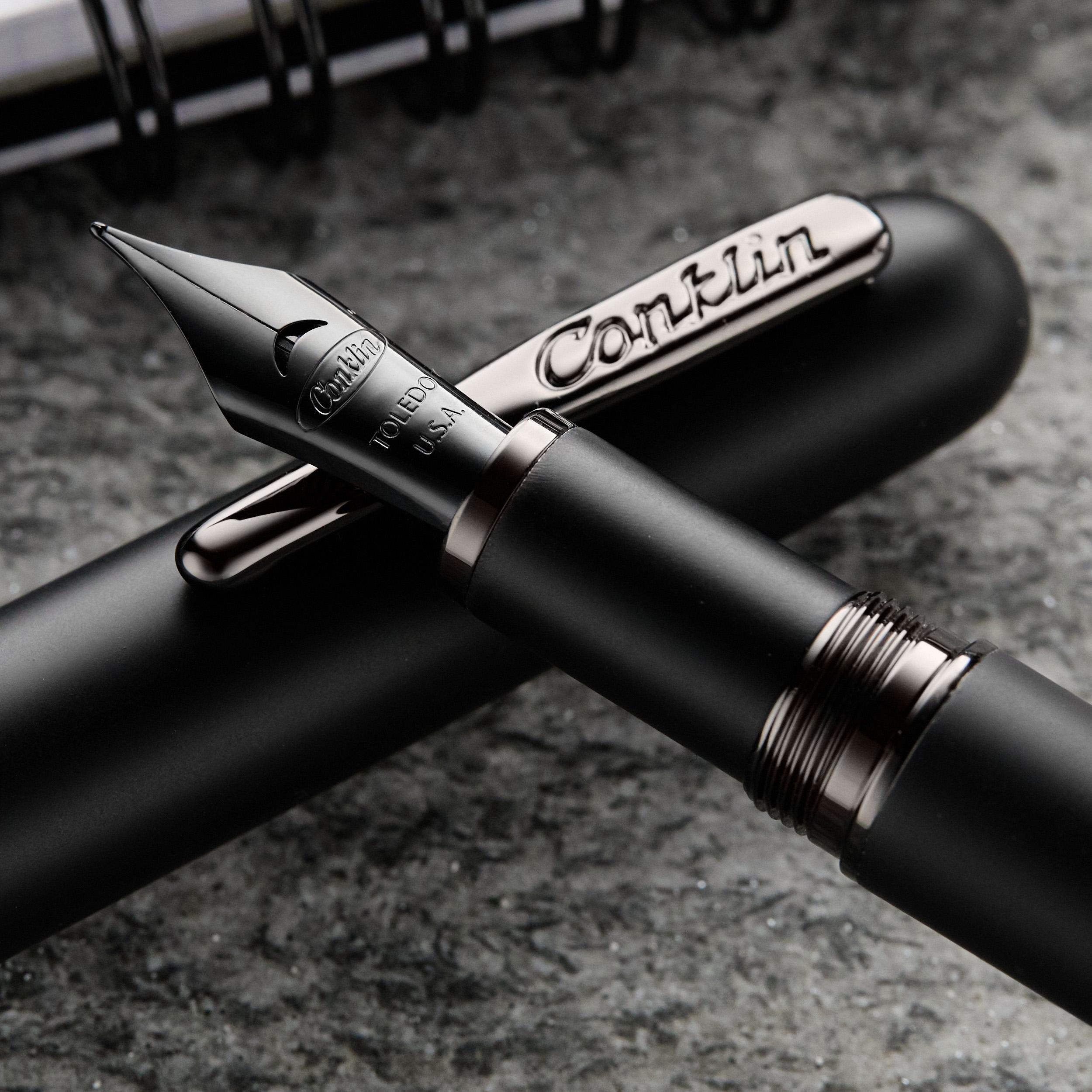 an image of a fountain pen and a pen with a pen cap