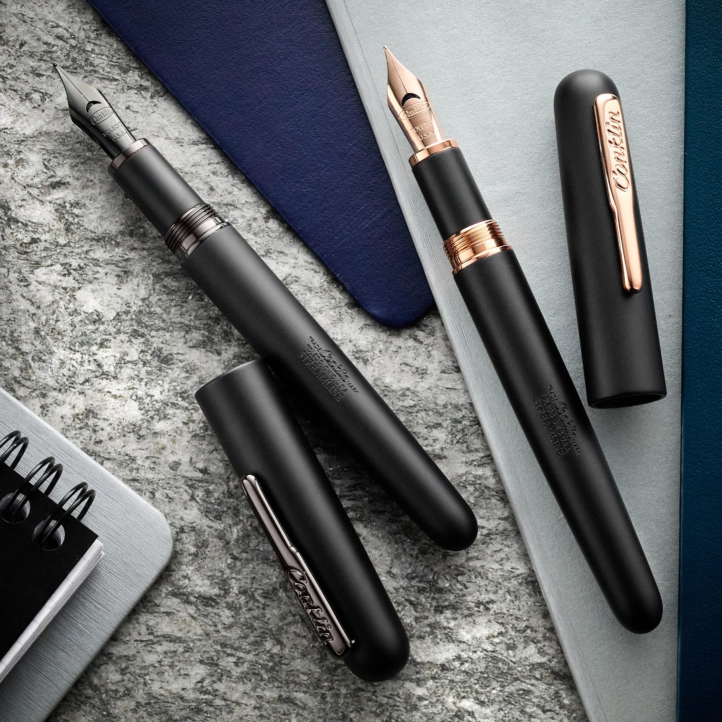an image of a pen and notebook on a table with a notebook