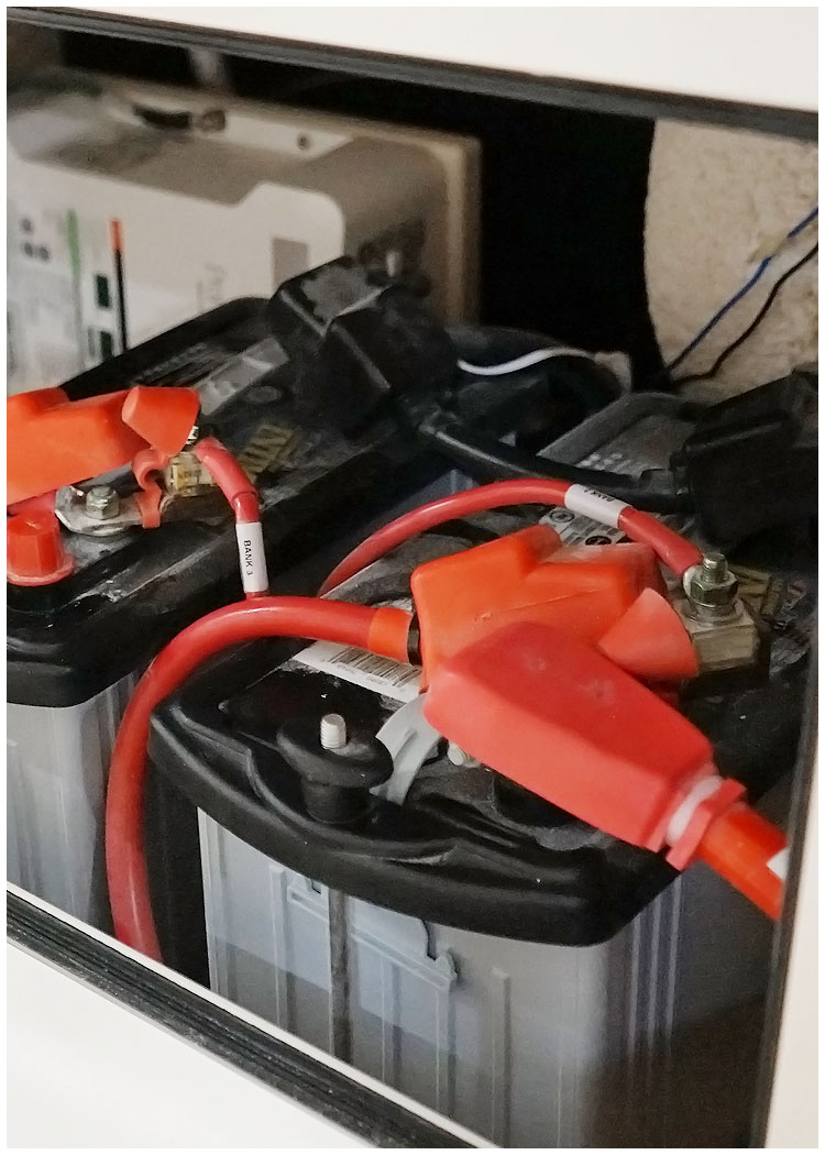 Marine batteries connected to the electrical system of a Grady-White boat