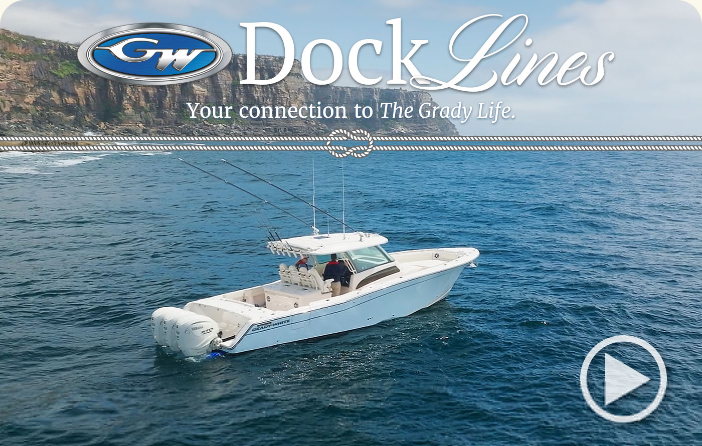 Canyon 336 center console boat on the water in Australia near cliffs and a shore