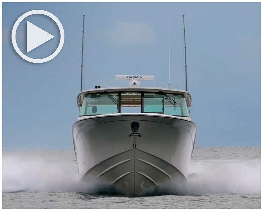 Freedom 415 dual console boat running bow-on toward viewer