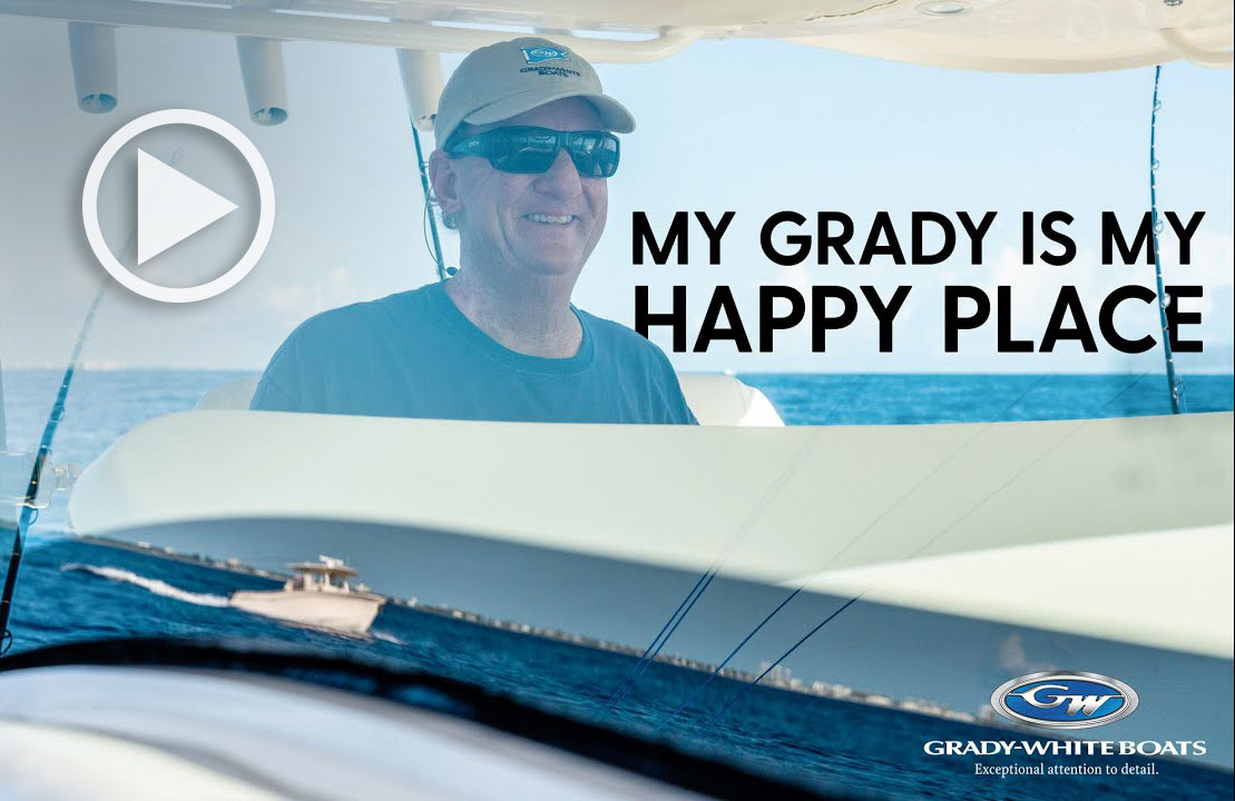 Man on board a Grady-White boat. Text in image reads: My Grady is my happy place