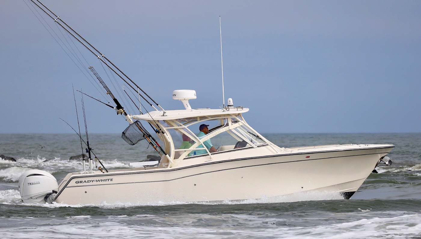 Freedom 307 dual console on the water starboard side