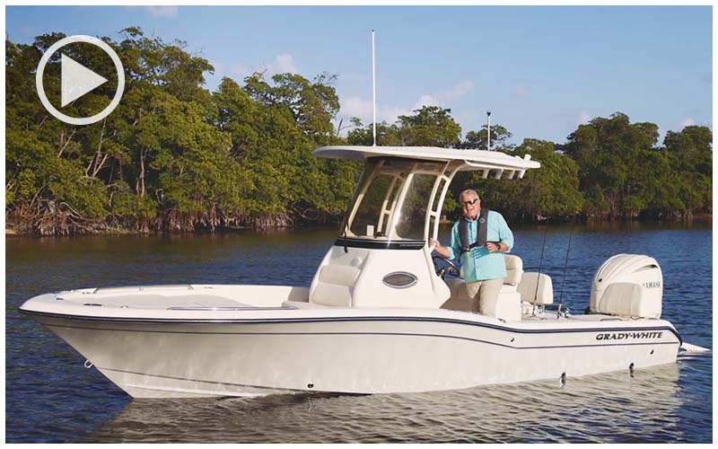 Man at the helm of a Grady-White 231 Coastal Explorer