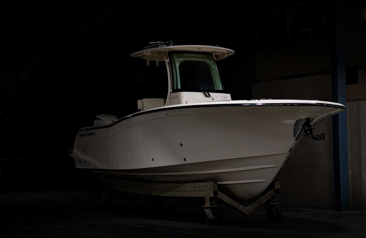 Grady-White Canyon 266 bow view of boat awaiting shipment in darkened factory