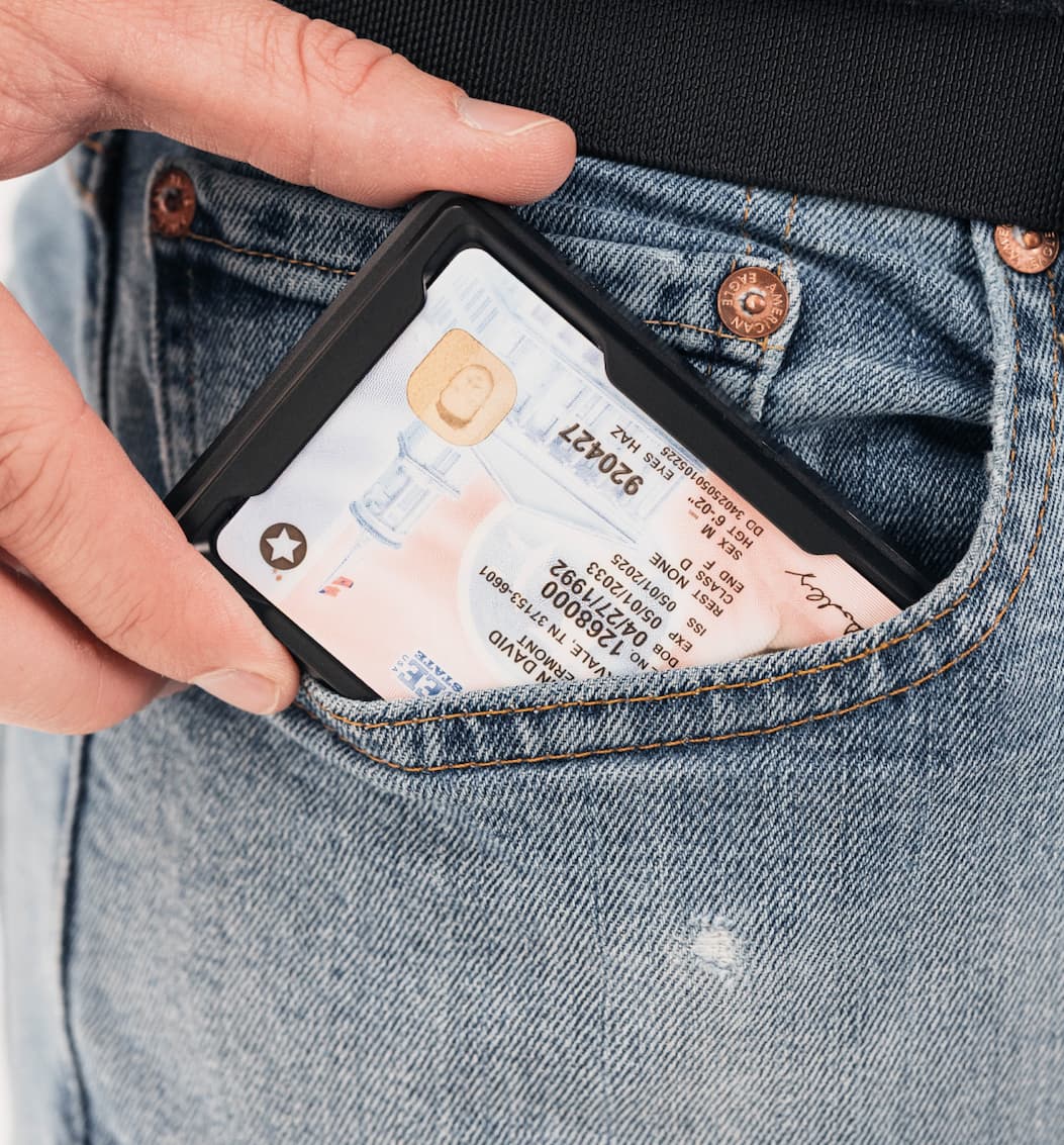 image of a groove wallet with the new id holder being pulled out of a pocket.