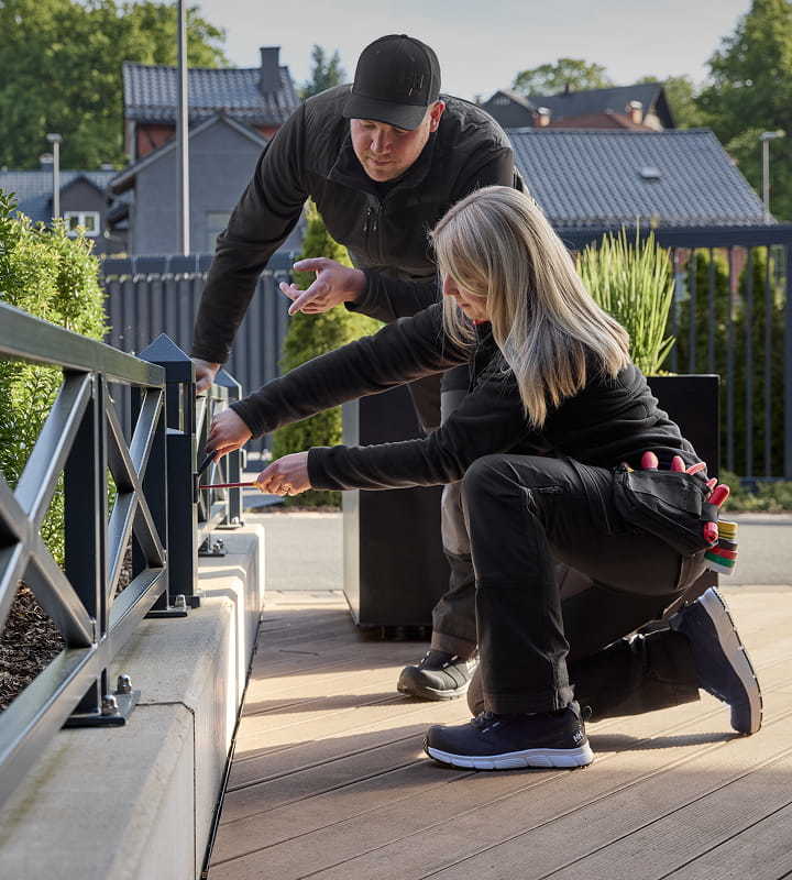 Couple using workwear for the jobs at home