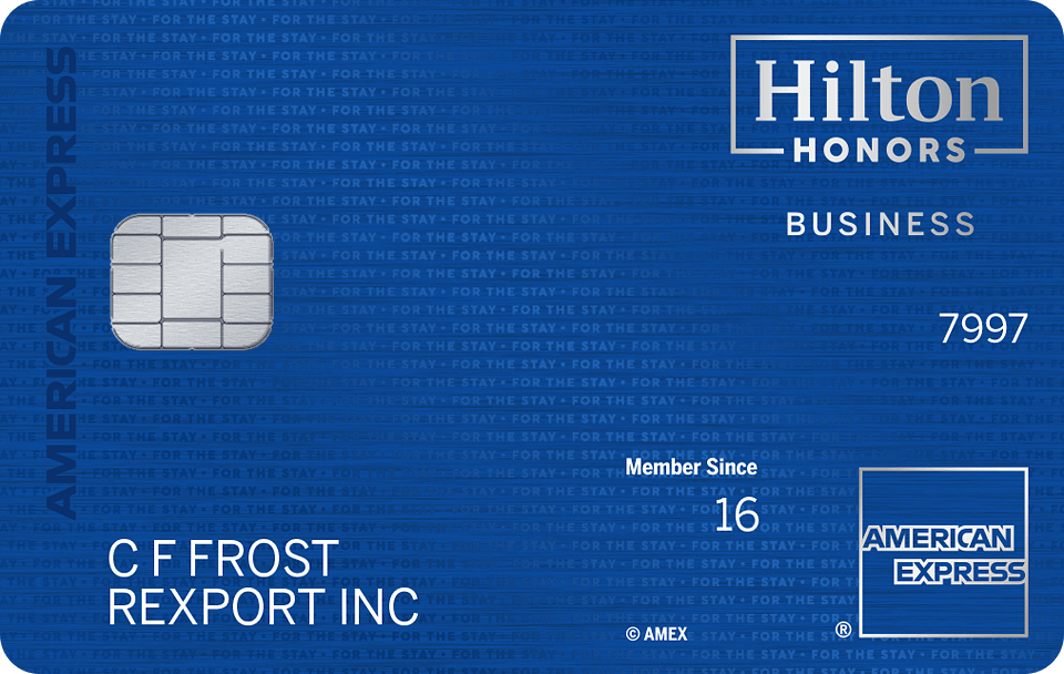 A blue Amex Hilton Honors Business Card with chip.