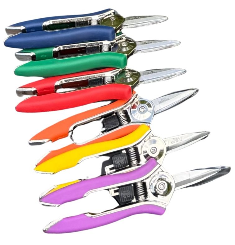 Multicolored Pruning Shears lined up on display against a white background.