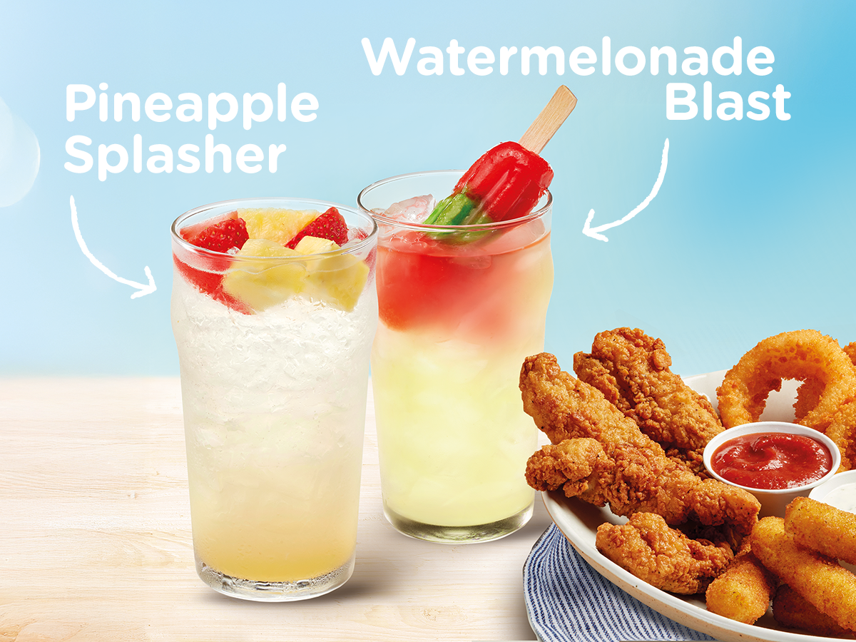 Two drinks in glasses on a table with a plate filled with chicken strips, onion rings, and mozzarella sticks.