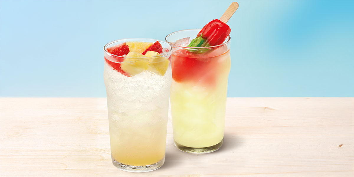 A photo of a Pineapple Splasher and the Watermelonade Cooler, which has an upside down popsicle in it.