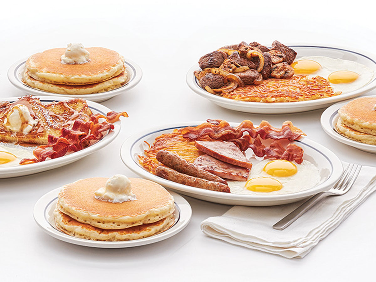 Images of IHOP Breakfast Combos, including the Breakfast Sampler with eggs, bacon, ham, and hash browns, and Sirloin Tips with hash browns and eggs, with sides of pancakes.