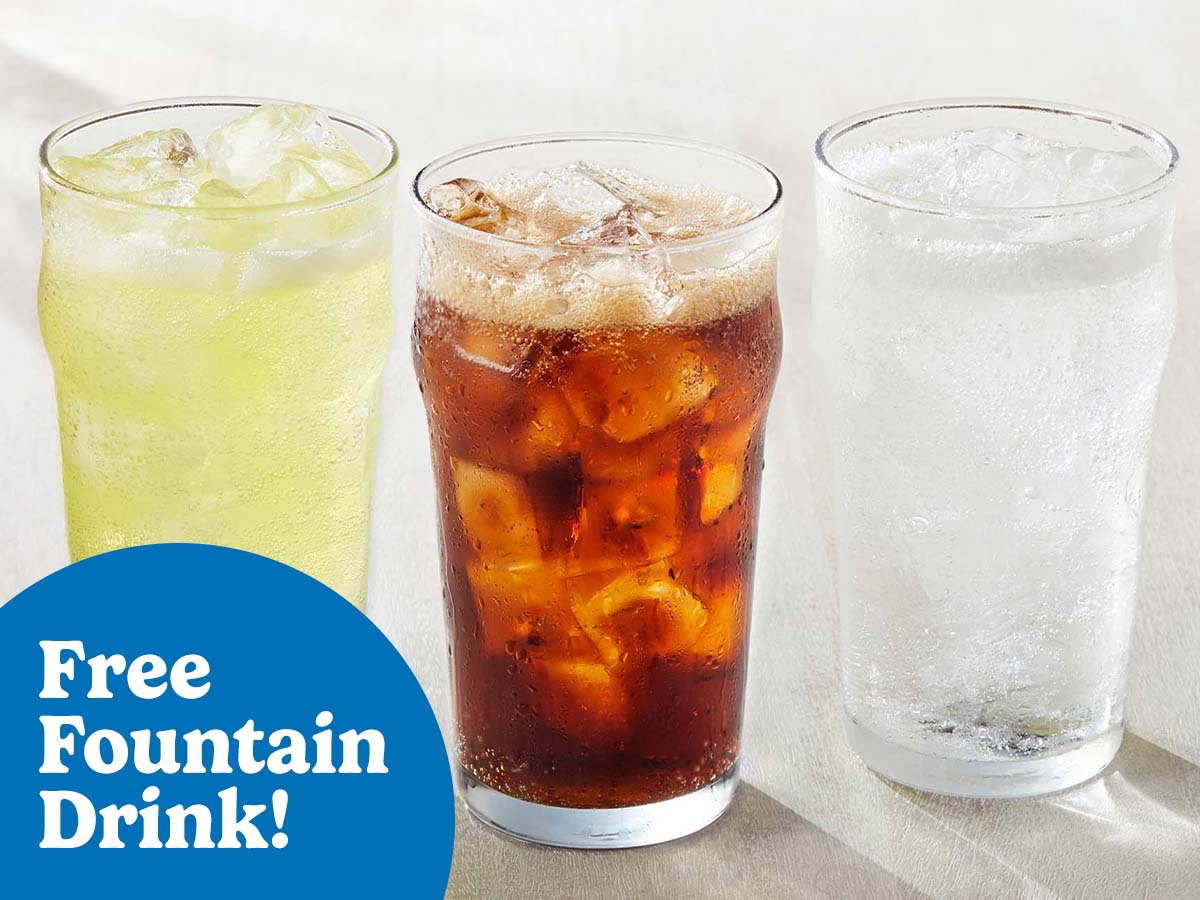 A glass of lemonade, Pepsi, and Starry with ice are on a gray tabletop