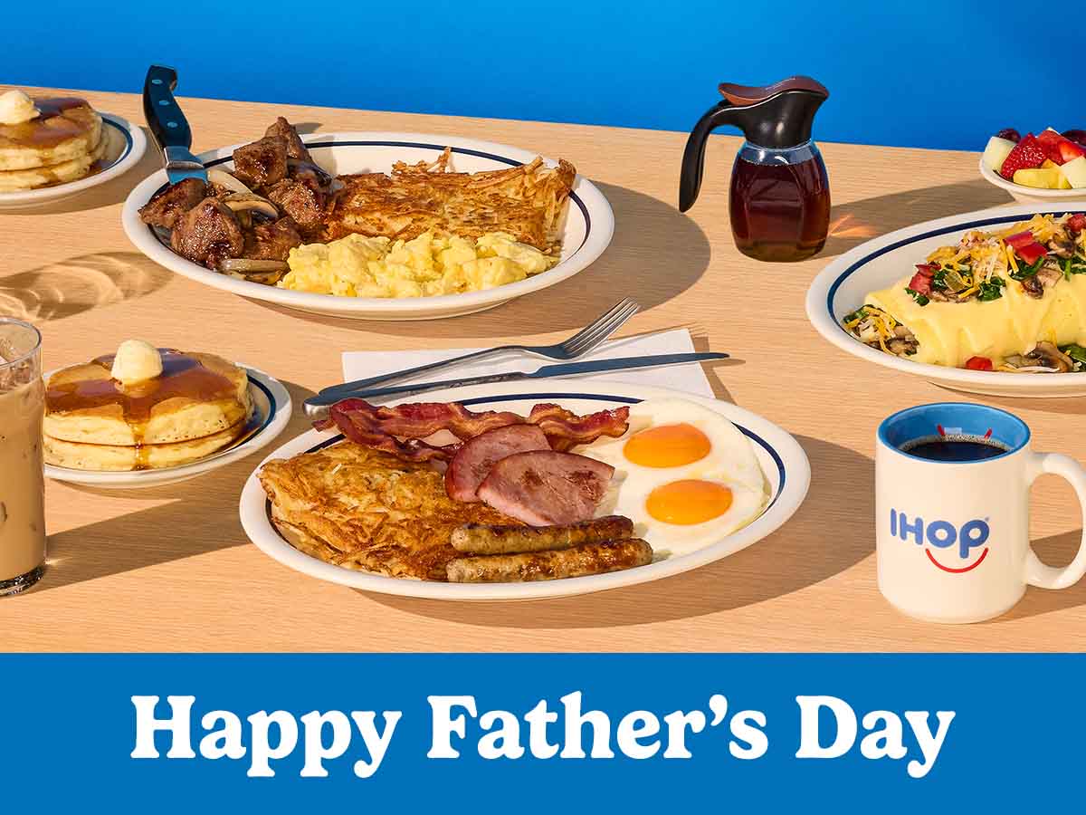 A spread of IHOP food, including a Breakfast Sampler, pancakes, and a Stuffed ‘N Stacked omelette on a table