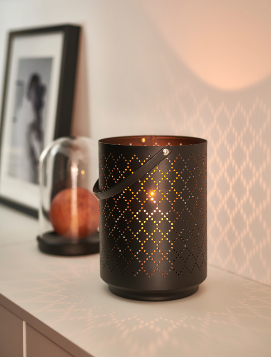 Candle on top of a mantle