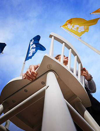 Person carrying a chair into IKEA