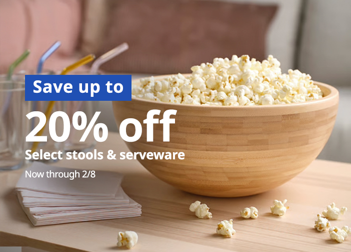 Wood popcorn bowl on table.