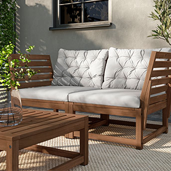 A patio offering seating with the NÄMMARÖ 2-seat modular sofa with Kuddarna cushions.