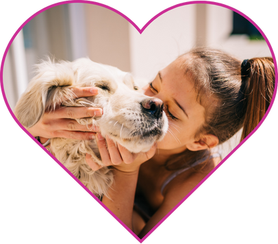Woman kissing her dog