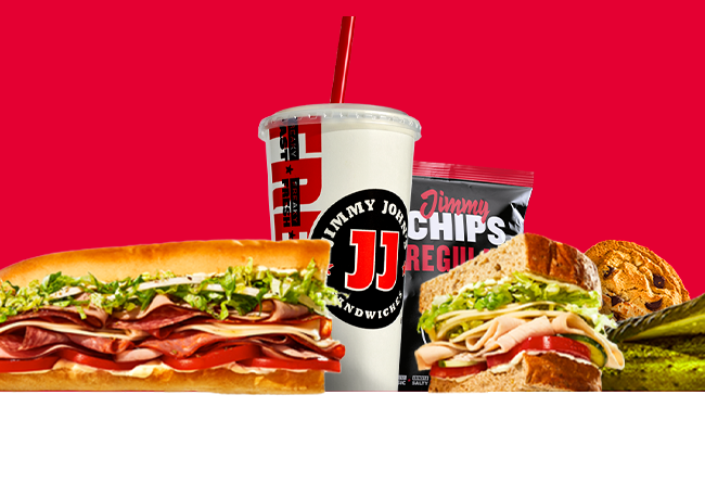 Image of sandwiches, drink, chips, cookie, and pickle.