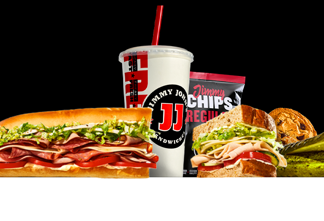 Image of sandwiches, drink, chips, cookie, and pickle.