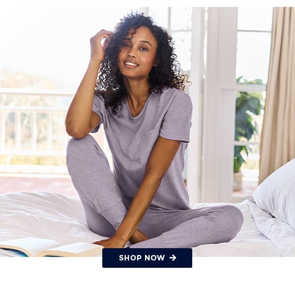 sleep and loungewear banner image on model / shop now