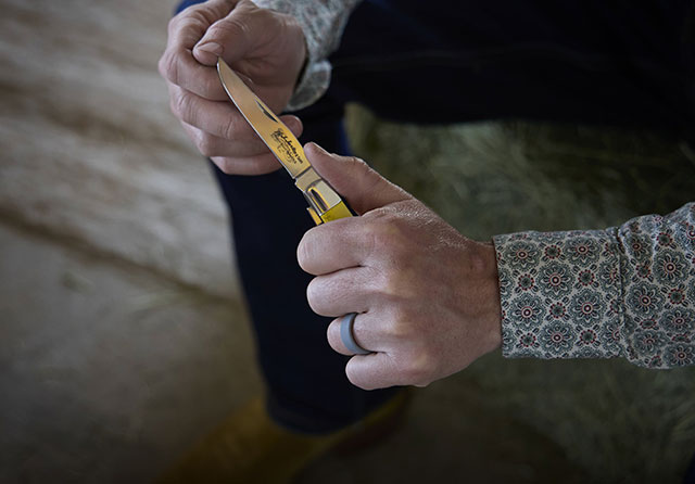 A man holding a pocket knife.