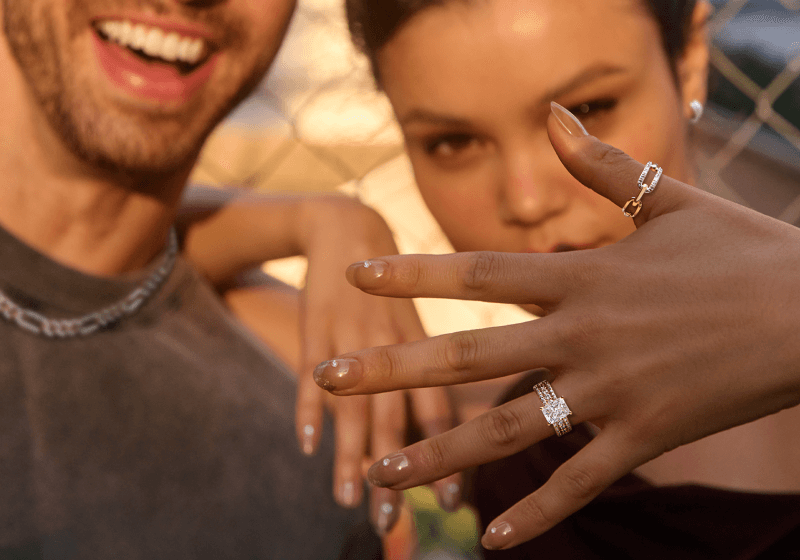 Woman showcasing stunning rings on her left hand