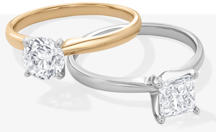 Solitaire rings stacked on one another.