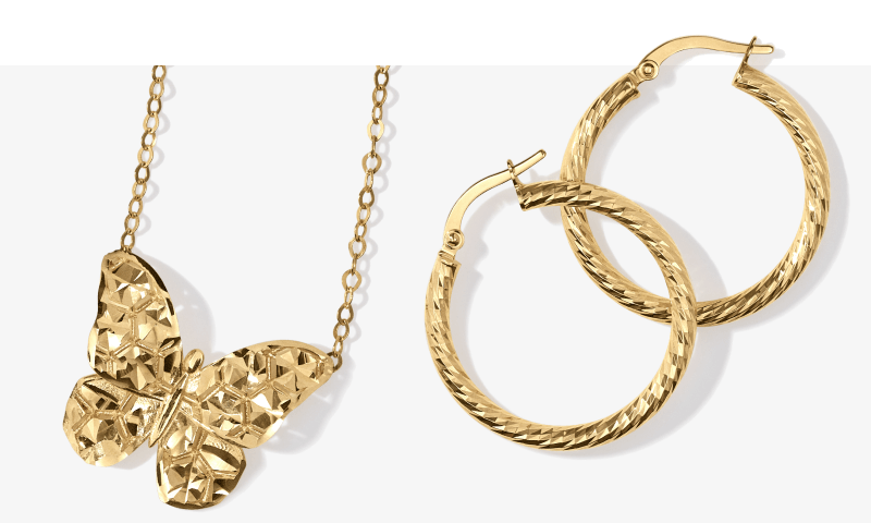 Two examples of gold jewelry, including a butterfly pendant necklace and hoop earrings